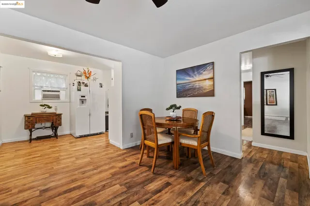 a dining room with furniture and window