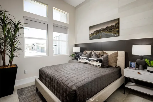 a bedroom with bed and window