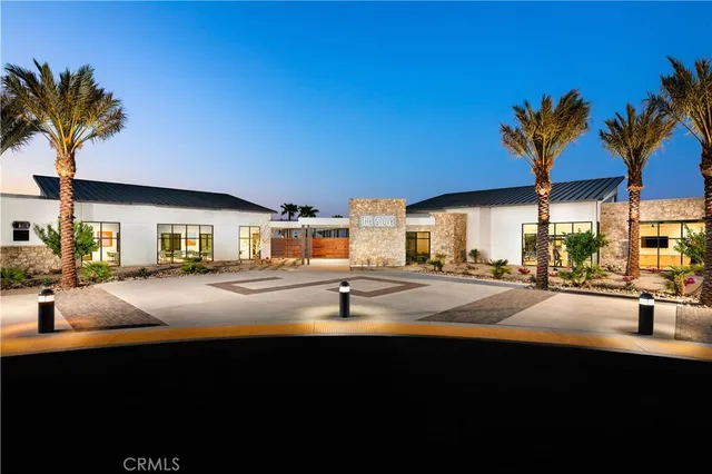 a front view of house with yard and trees