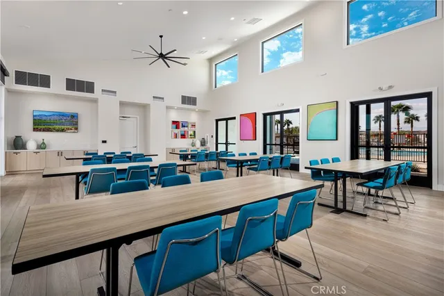 a room with lots of wooden furniture table and chairs