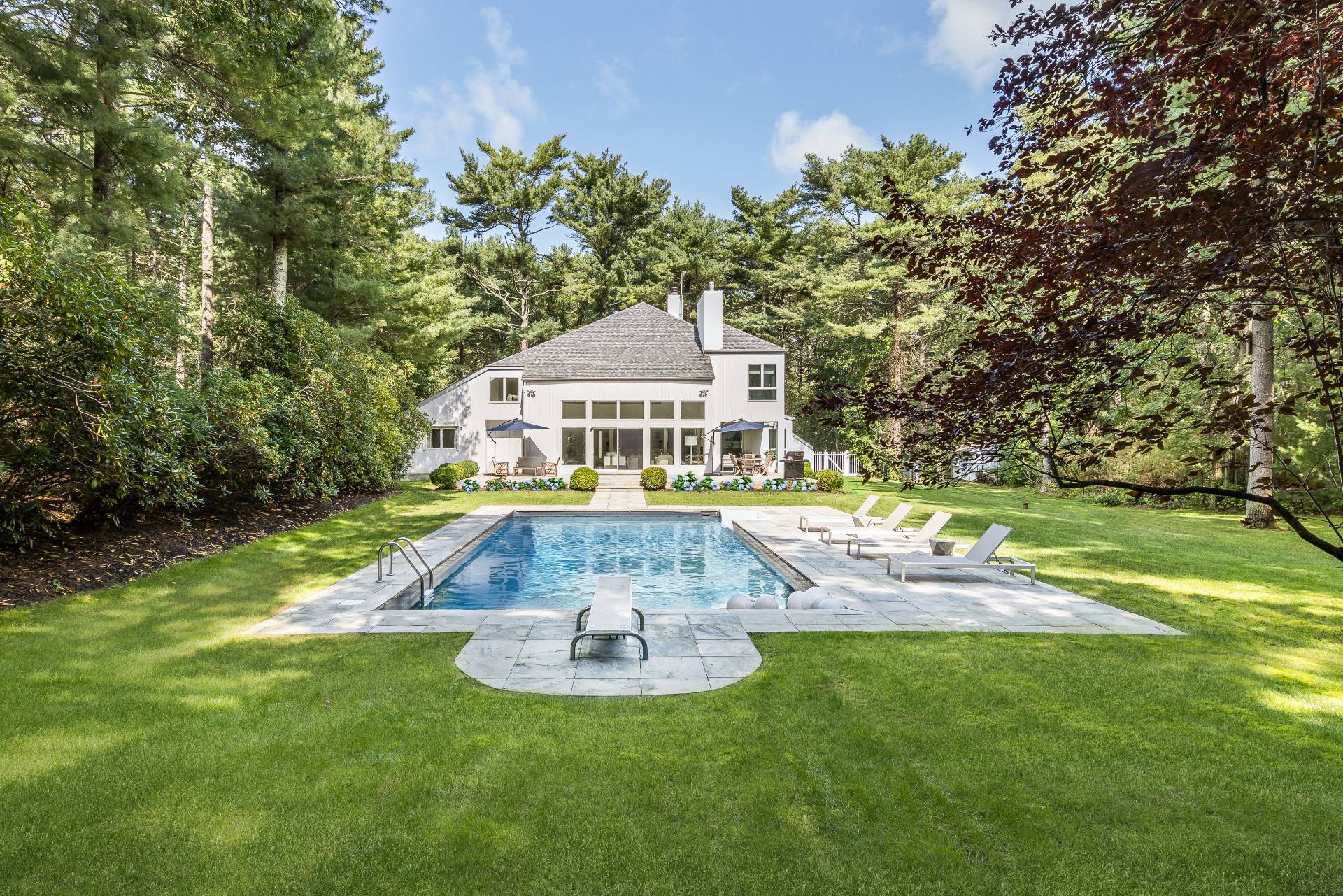 52 Bull Path East Hampton, NY 11937 - Photo 21 of 24 a view of a house with a swimming pool