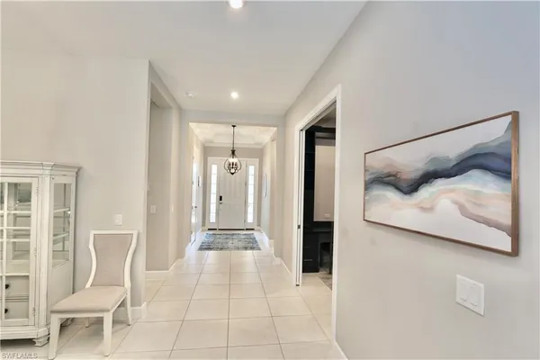 a view of a bedroom with furniture and wooden floor