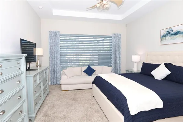 a bedroom with a bed and a night stand