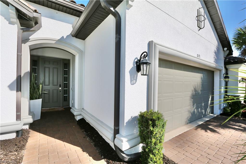 8191 Lucello Terrace North Naples, FL 34114 - Photo 2 of 42 a view of a porch with seating space