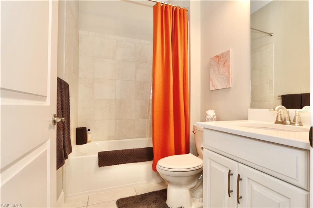 8191 Lucello Terrace North Naples, FL 34114 - Photo 22 of 42 a bathroom with a sink a toilet and shower