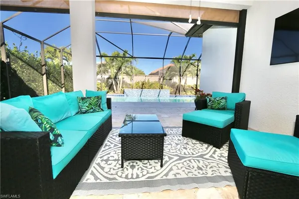 a living room with furniture and a rug