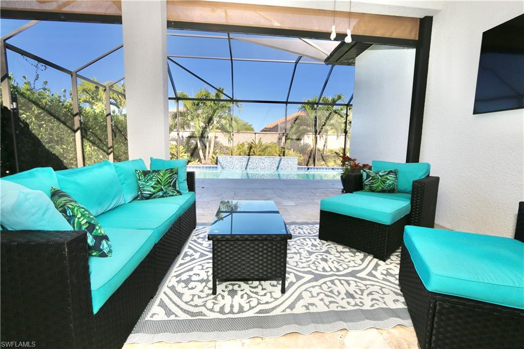 8191 Lucello Terrace North Naples, FL 34114 - Photo 26 of 42 a living room with furniture and a rug