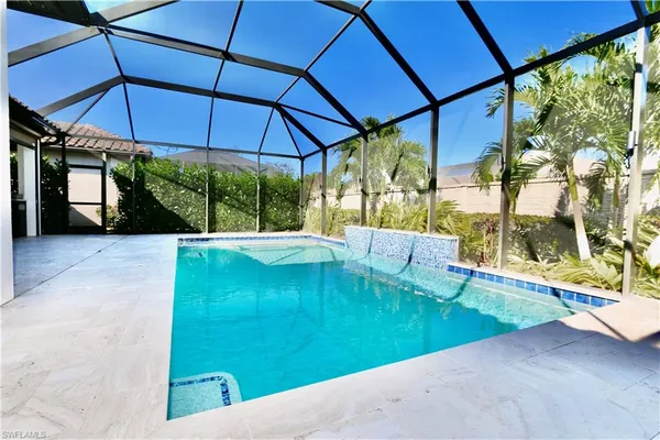 a view of a swimming pool with a yard