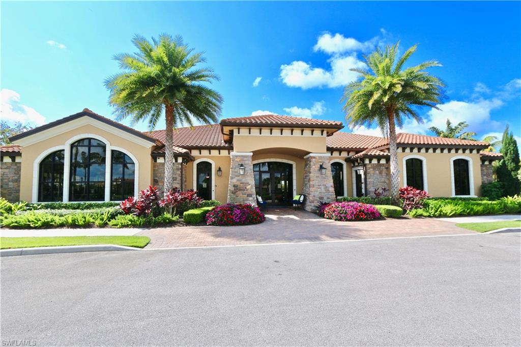 8191 Lucello Terrace North Naples, FL 34114 - Photo 29 of 42 a front view of a house with a garden and palm tree