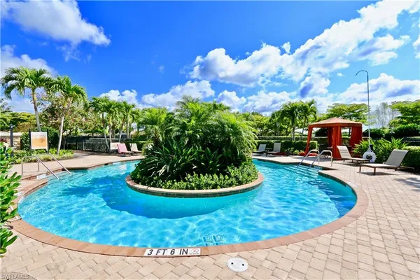 a view of a swimming pool with a yard