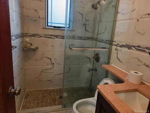 a bathroom with a sink and toilet