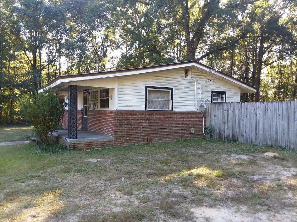 6254 Winstead Road Crestview, FL 32539 - Photo 3 of 5 a view of a house with a yard and large tree