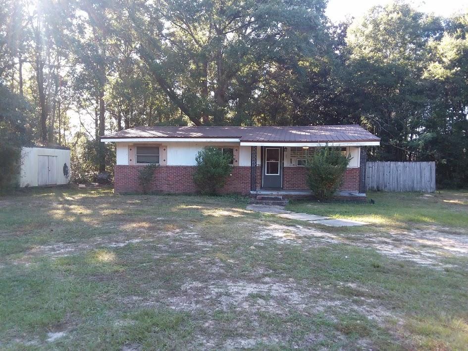 6254 Winstead Road Crestview, FL 32539 - Photo 5 of 5 a front view of a house with a garden