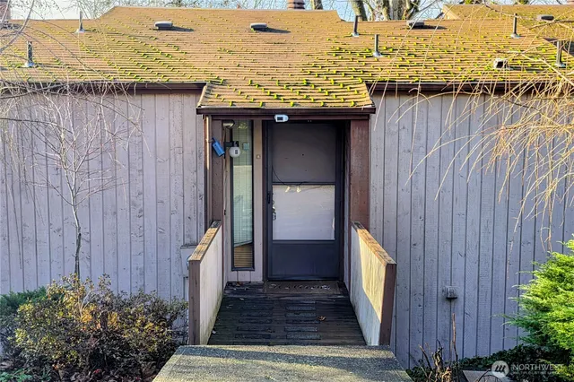a view of a pathway with a wooden fence