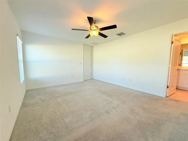 a bathroom with a shower sink and mirror