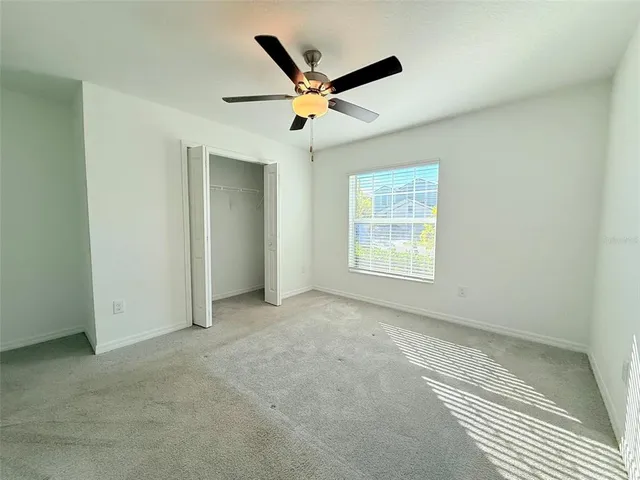 a bathroom with a toilet a sink a mirror and shower