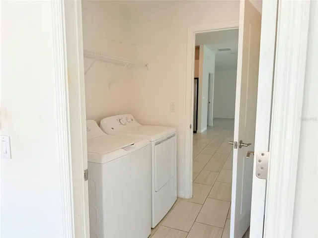 a view of a tub and window in the room