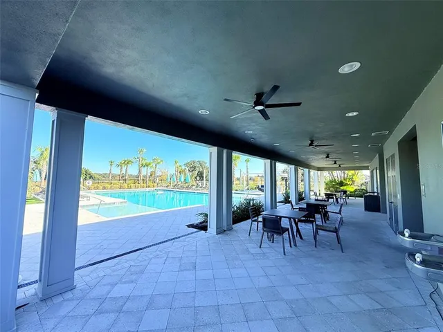 a view of a lake with couches and city view