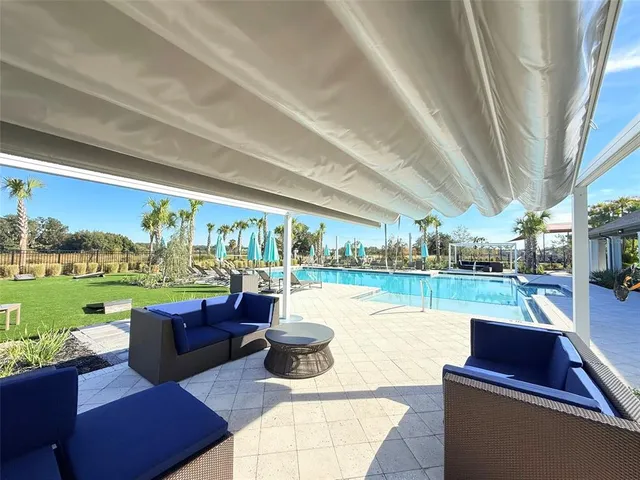 a backyard of a house with lots of green space and plants
