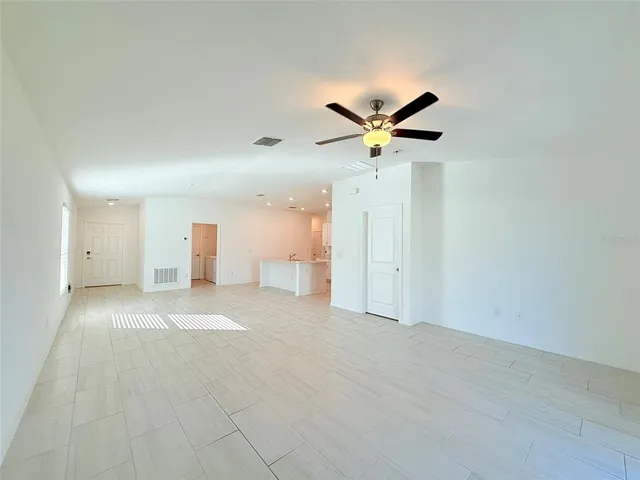 a kitchen with stainless steel appliances a refrigerator sink and microwave
