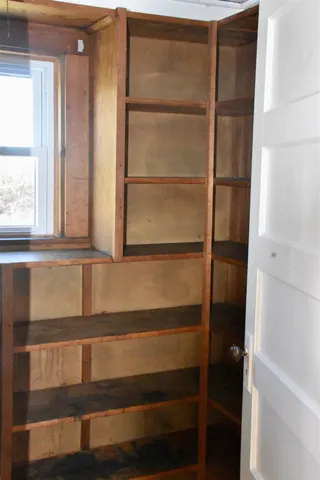 a kitchen with a sink cabinets and a window