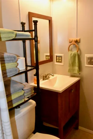 a bathroom with a sink toilet and shower