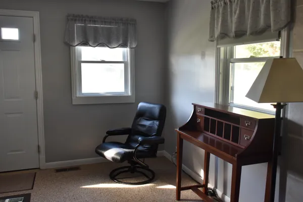 a view of front door and bedroom stairs