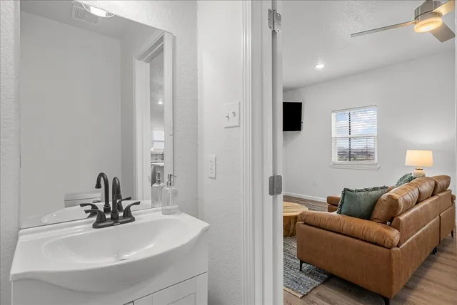 a bathroom with a sink and a mirror