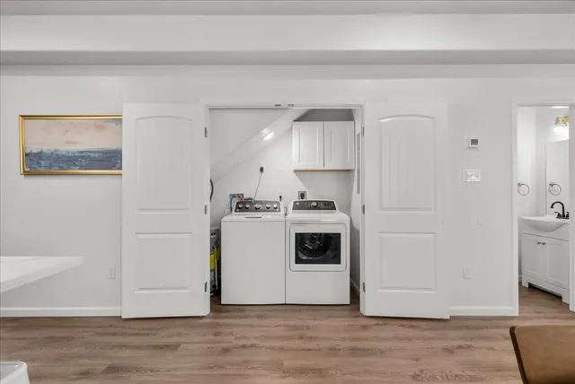 a kitchen with a stove a sink and a refrigerator