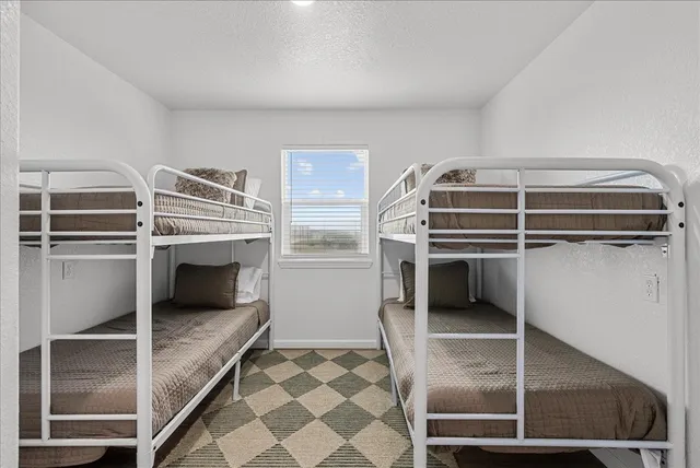 a kitchen with a refrigerator and a sink