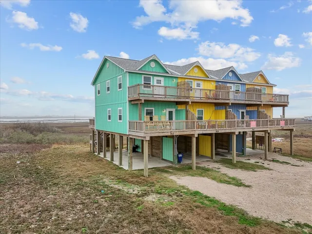 a view of house with an outdoor space and balcony