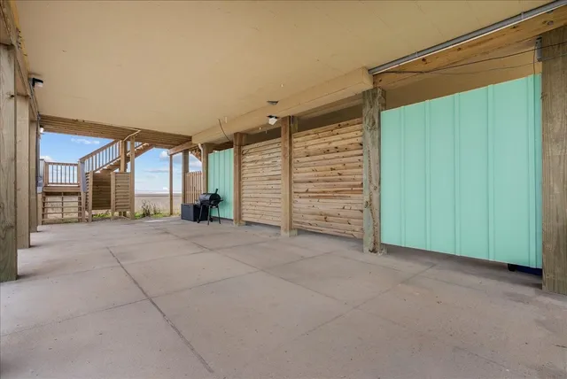 a view of a town with large trees and a small yard