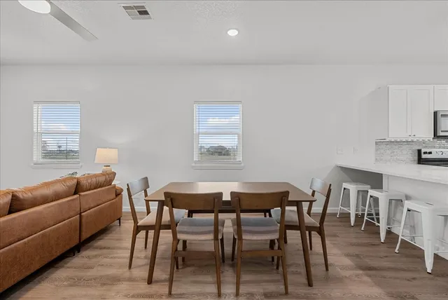 a view of a dining room with furniture