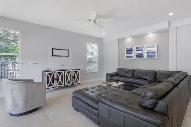 a living room with furniture and a window