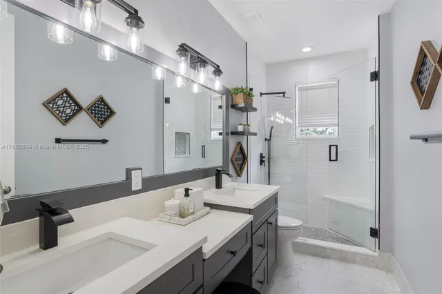 a view of a sink and washer dryer