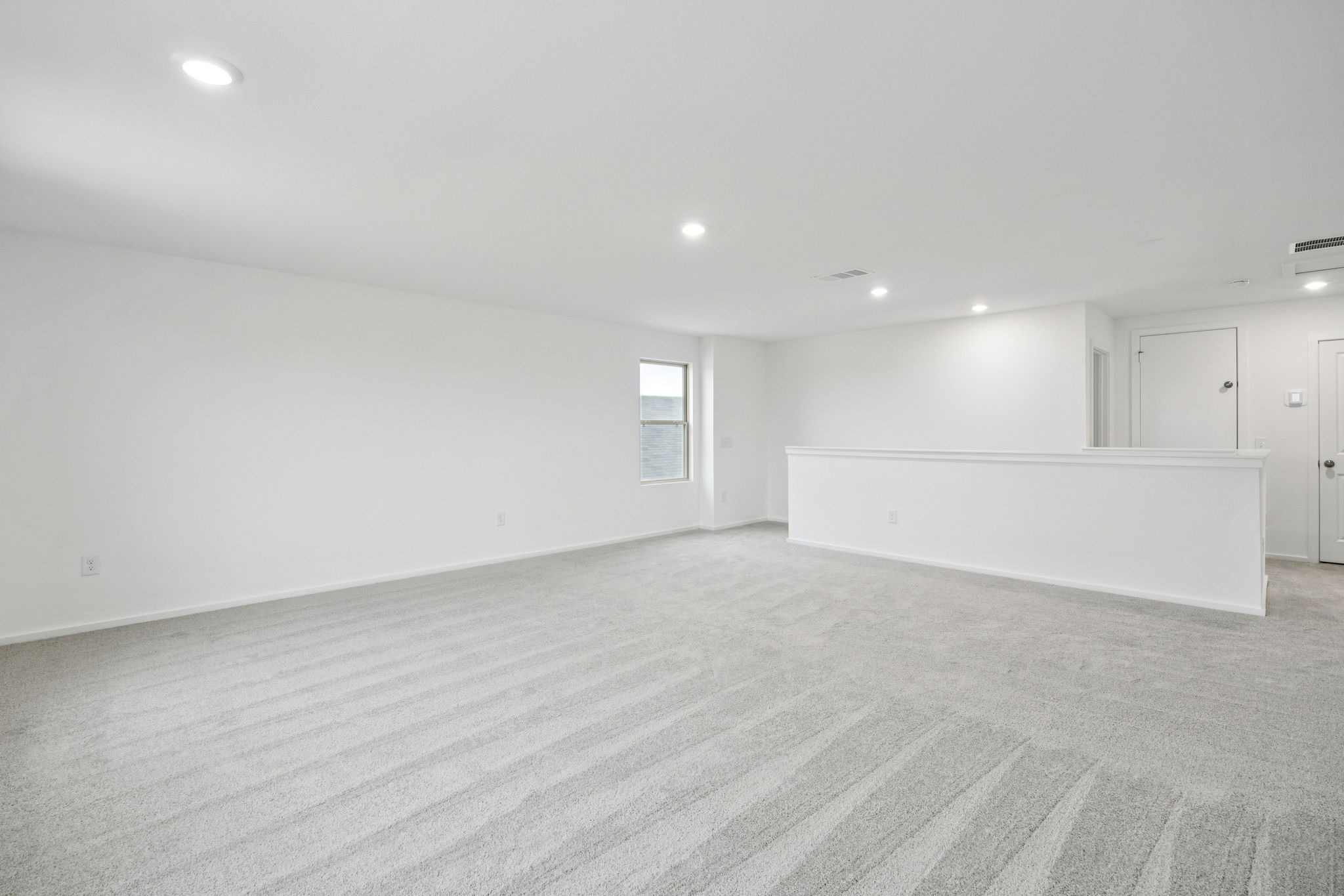 414 Point Nemo Street Crosby, TX 77532 - Photo 19 of 50 a view of an empty room with a kitchen