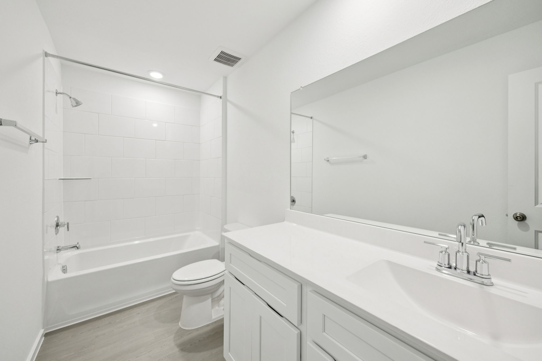414 Point Nemo Street Crosby, TX 77532 - Photo 23 of 50 a bathroom with a granite countertop sink a toilet and shower