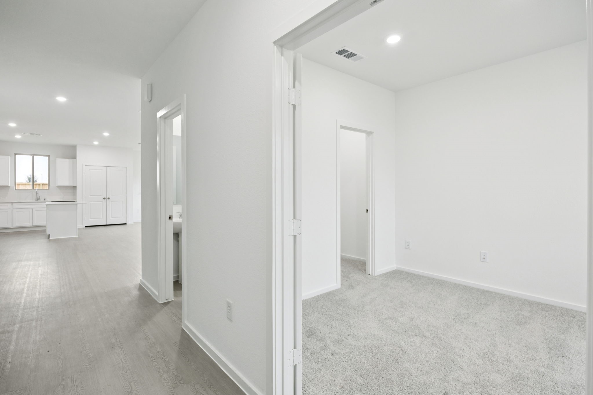 414 Point Nemo Street Crosby, TX 77532 - Photo 3 of 50 a view of a hallway with wooden floor