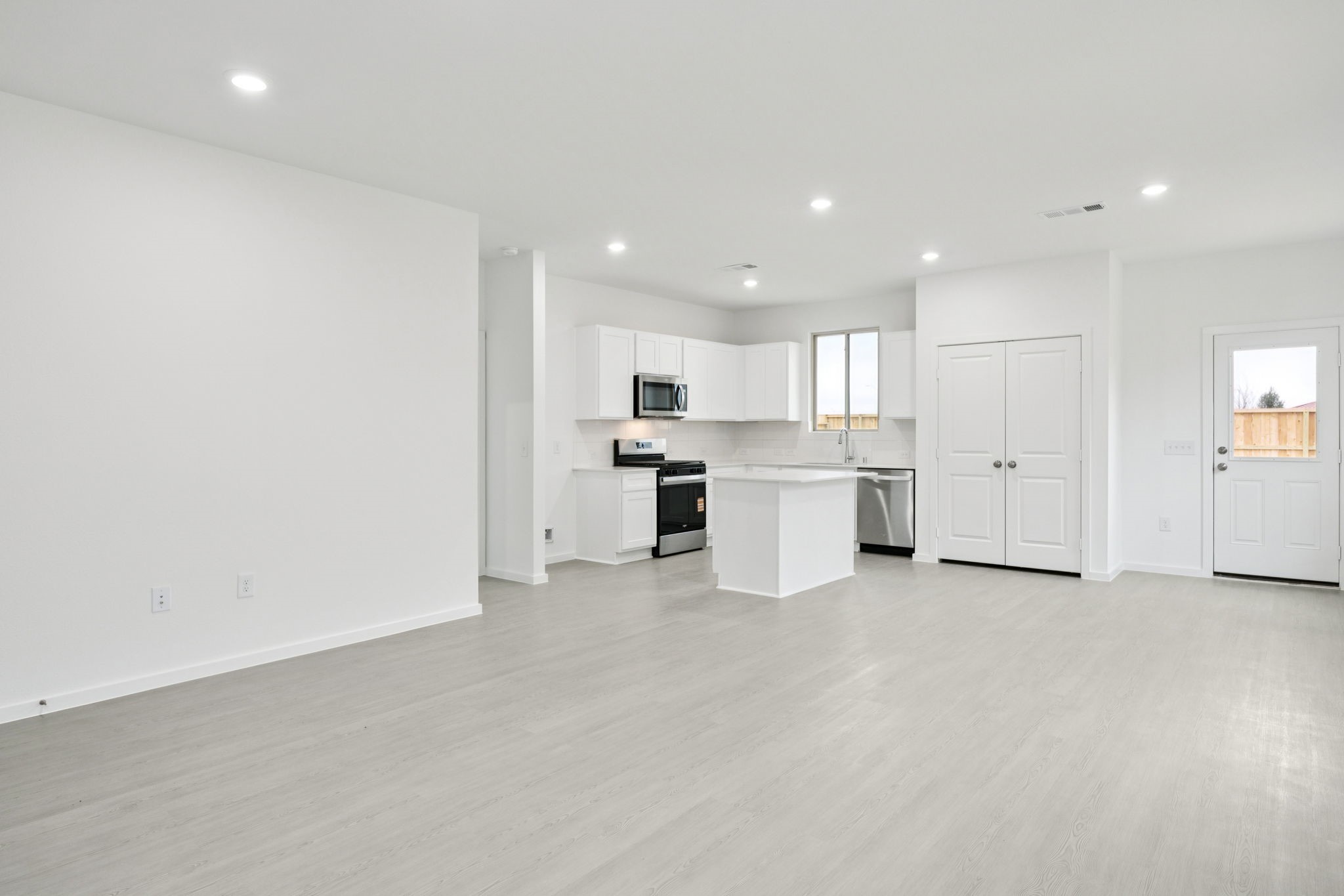 414 Point Nemo Street Crosby, TX 77532 - Photo 6 of 50 a view of a kitchen with white cabinets
