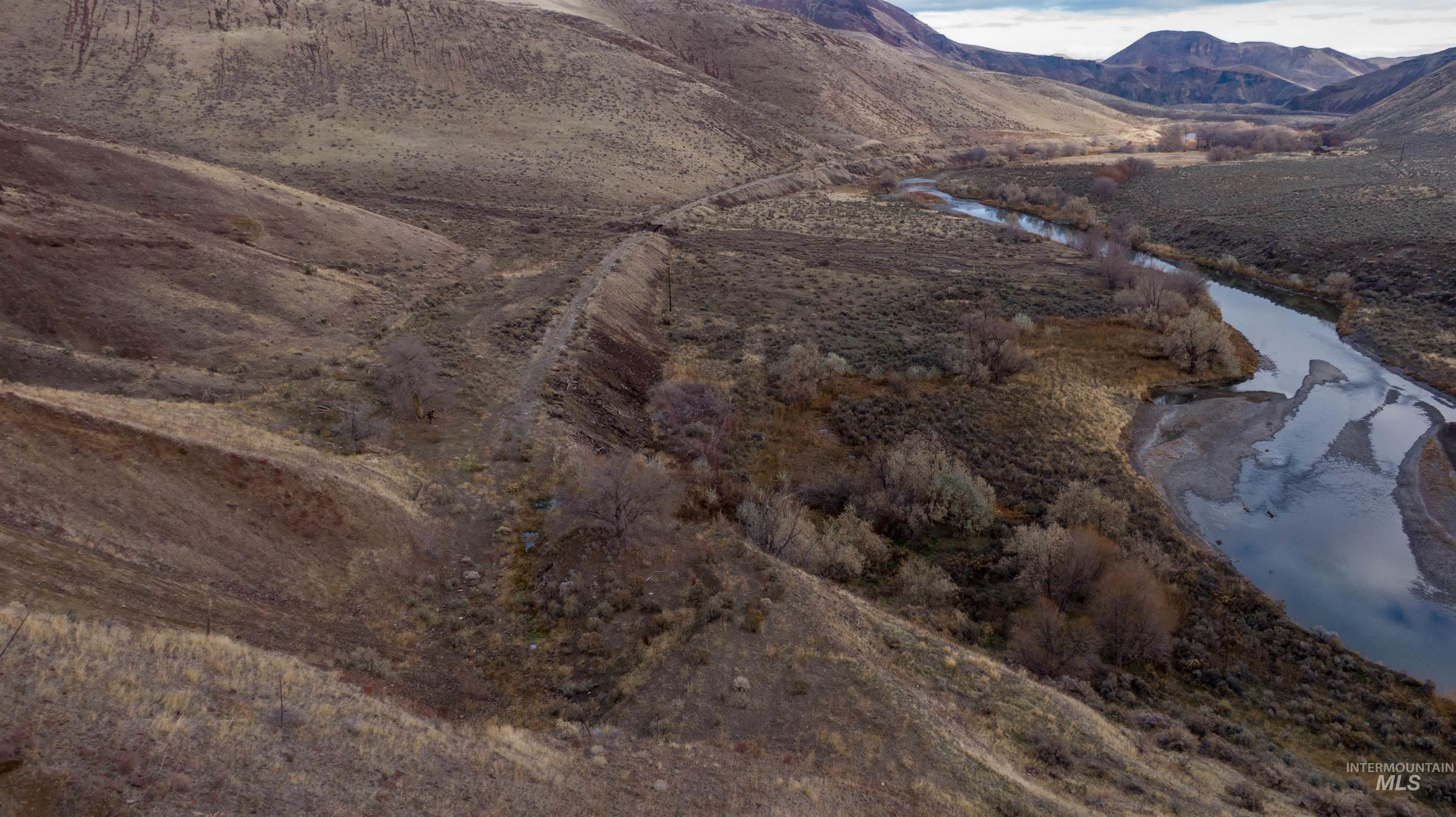 Tbd Juntura, OR 97911 - Photo 22 of 27 View of mountain backdrop with a nearby body of water