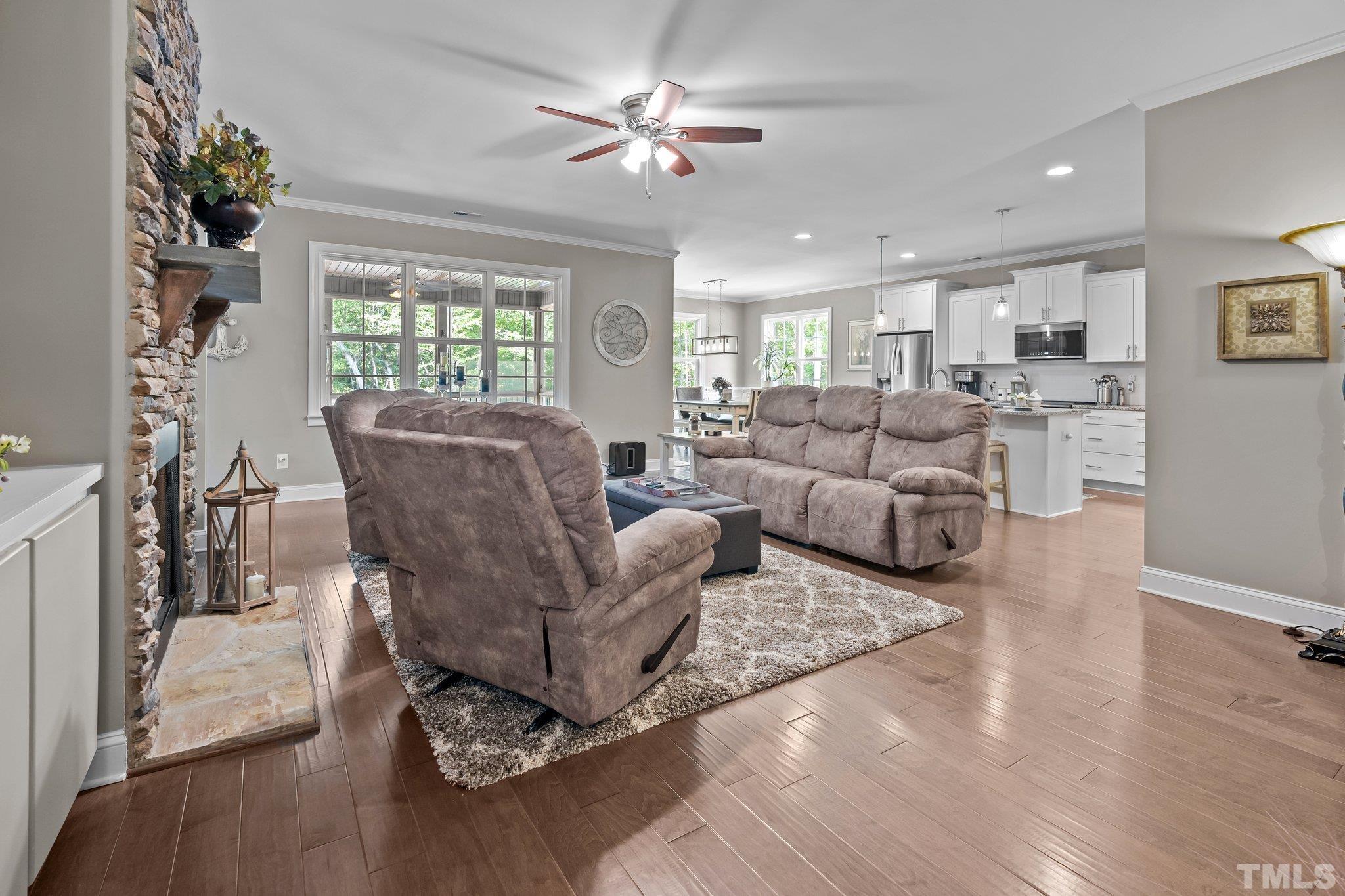 391 River Ridge Lane Timberlake, NC 27583 - Photo 11 of 47 a living room with furniture and a large window