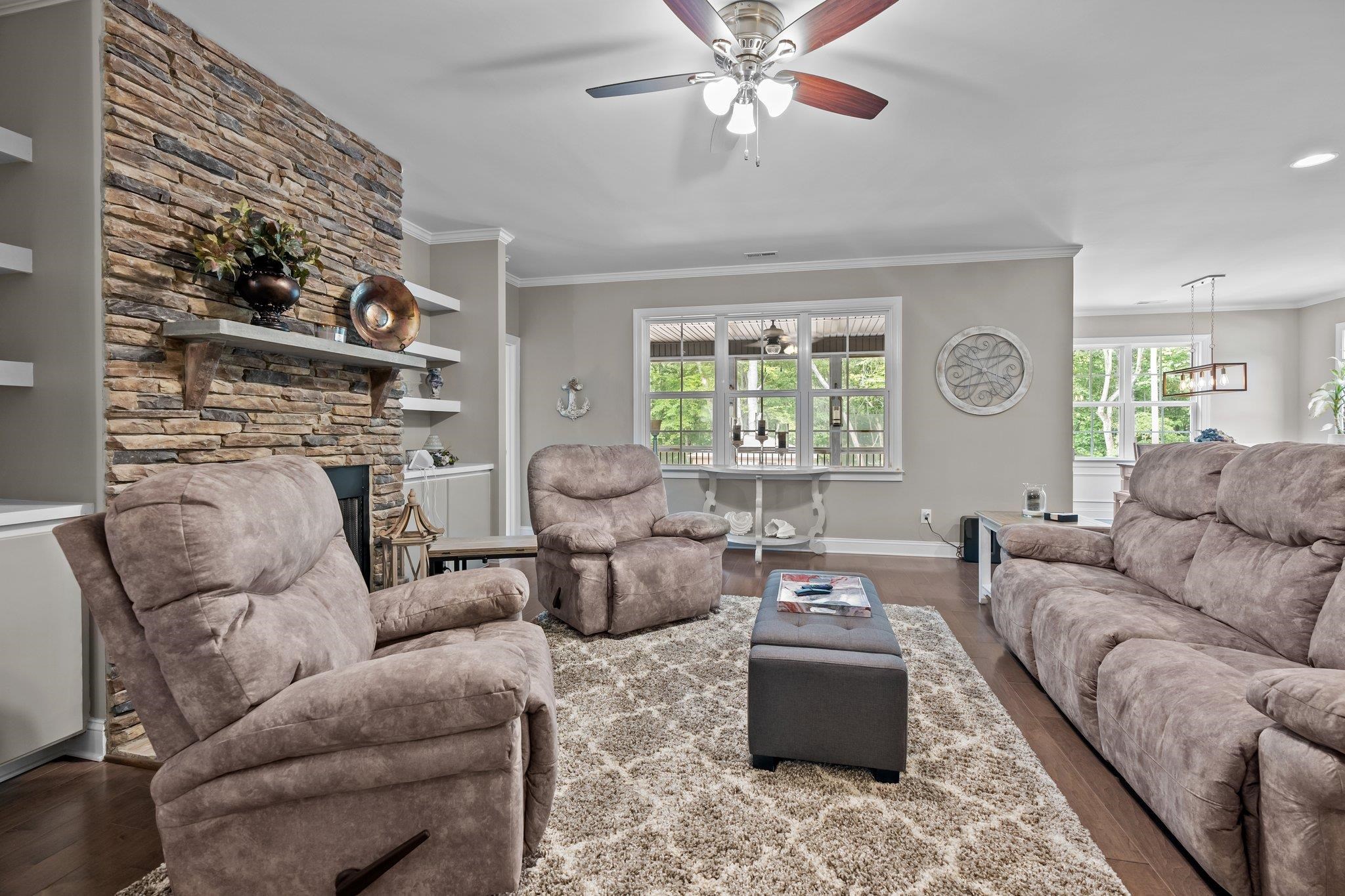 391 River Ridge Lane Timberlake, NC 27583 - Photo 18 of 47 a living room with furniture and a large window