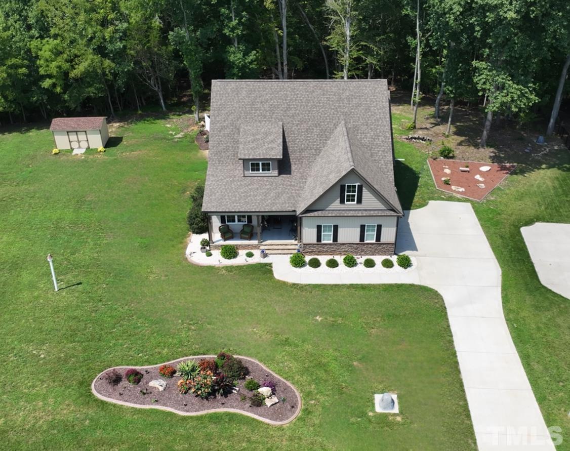 391 River Ridge Lane Timberlake, NC 27583 - Photo 2 of 47 a view of a house with a big yard