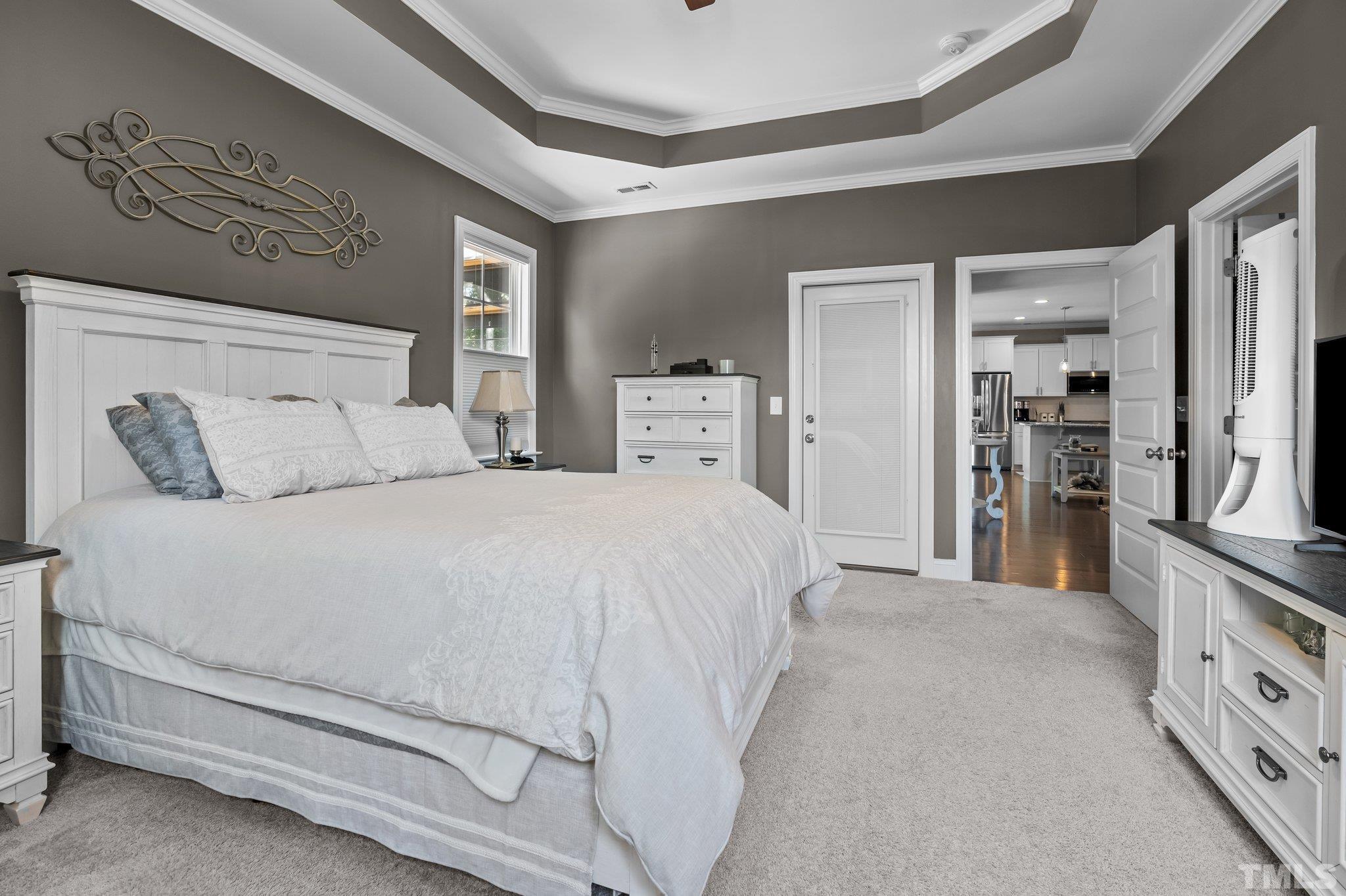 391 River Ridge Lane Timberlake, NC 27583 - Photo 22 of 47 a large white bed in a white room