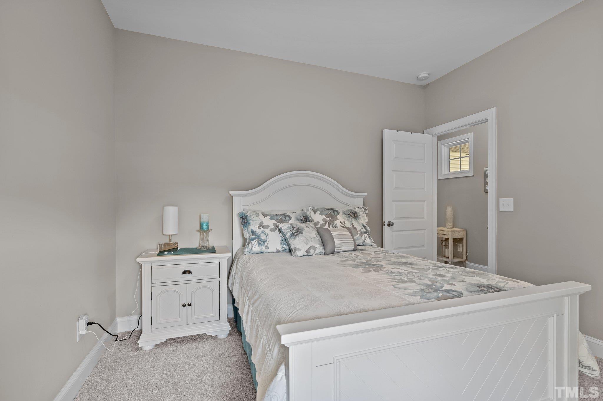 391 River Ridge Lane Timberlake, NC 27583 - Photo 28 of 47 a bedroom with a bed and a cabinets