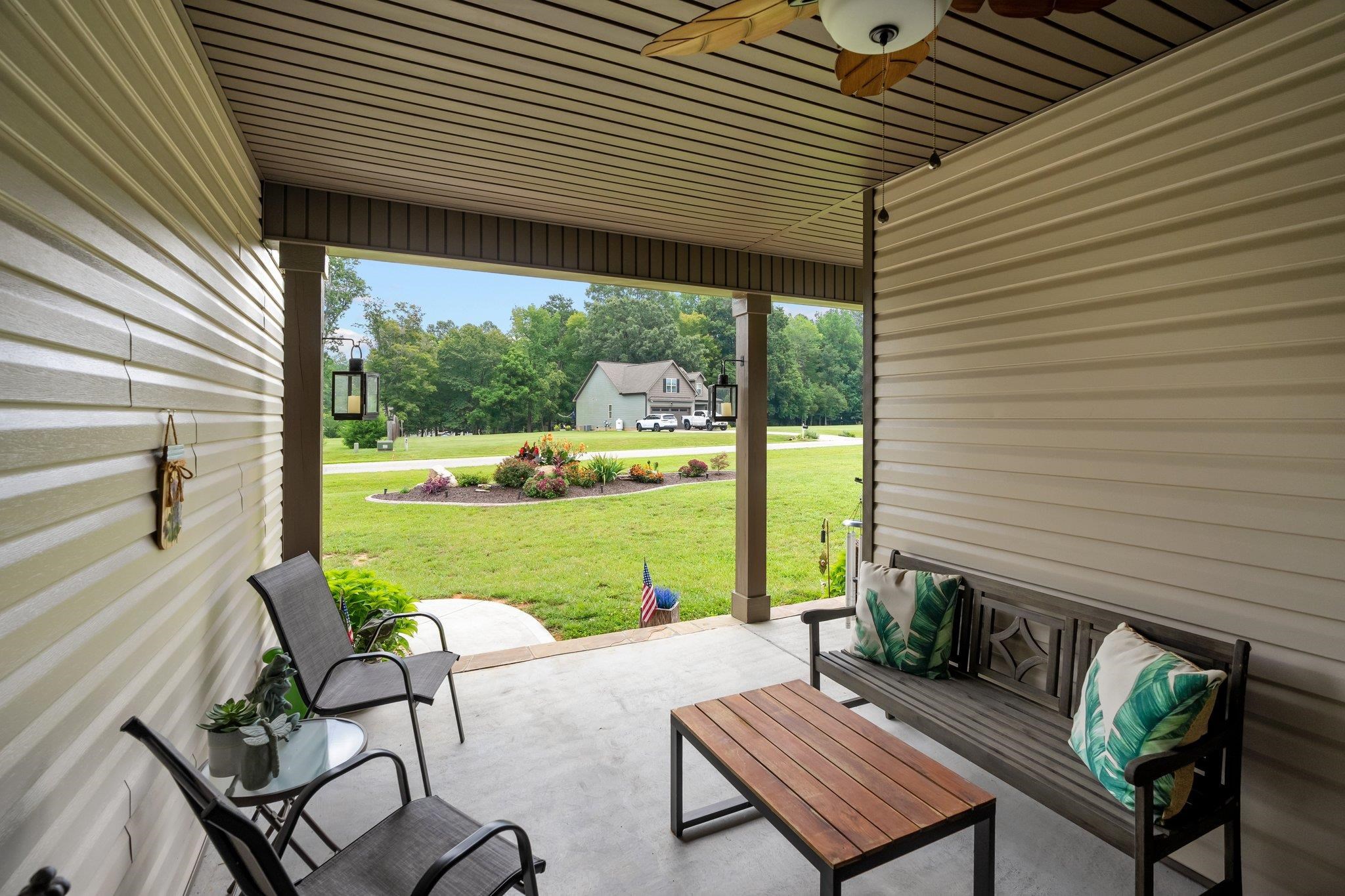 391 River Ridge Lane Timberlake, NC 27583 - Photo 36 of 47 a view of a patio with couches chairs and a table and chairs