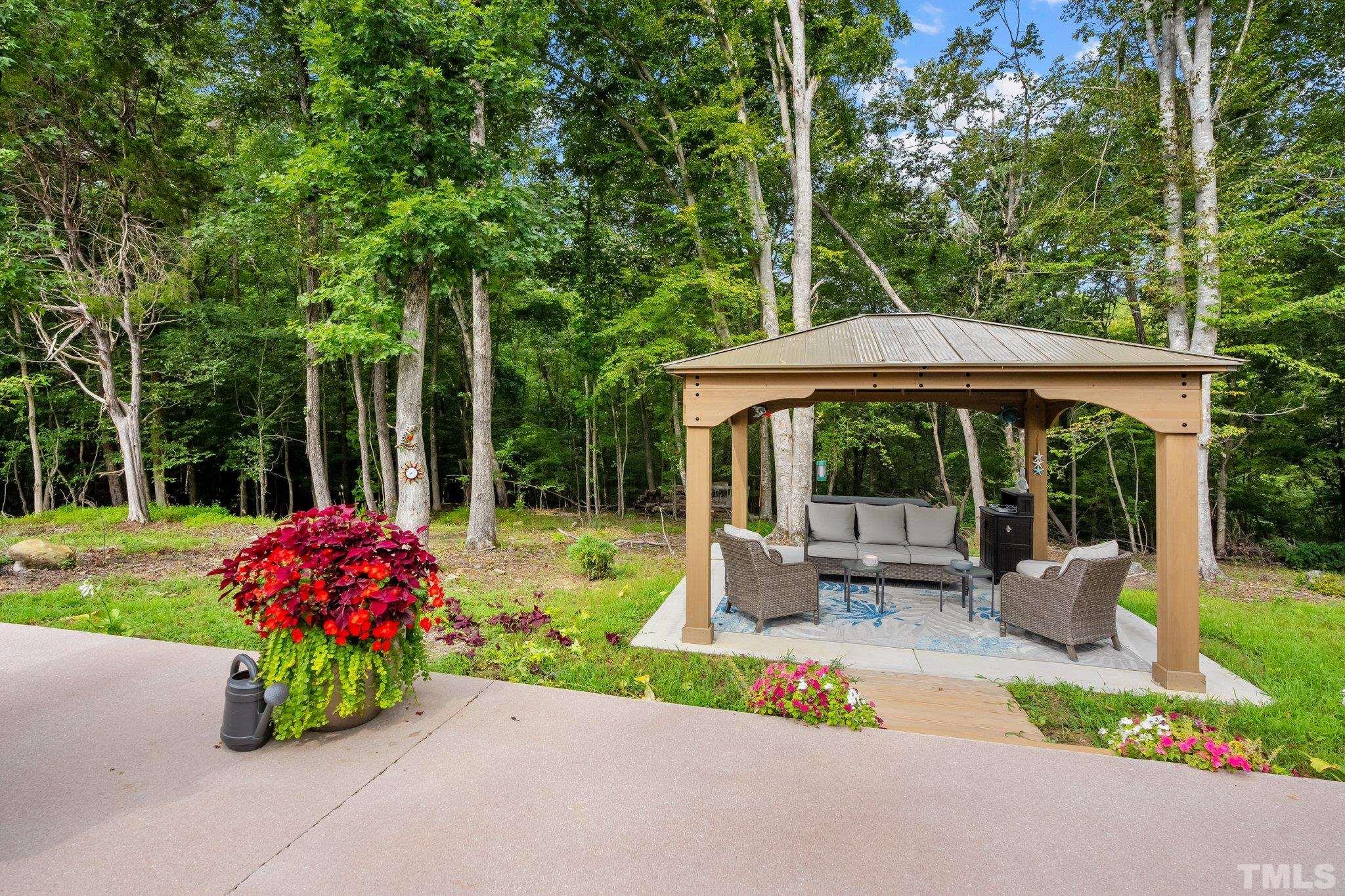 391 River Ridge Lane Timberlake, NC 27583 - Photo 37 of 47 a garden view with a seating space
