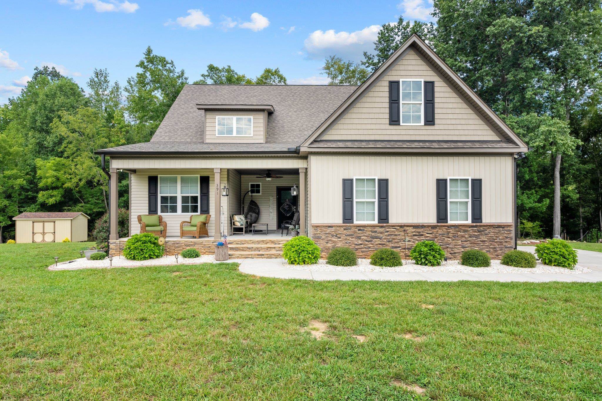 391 River Ridge Lane Timberlake, NC 27583 - Photo 4 of 47 a front view of a house with a yard