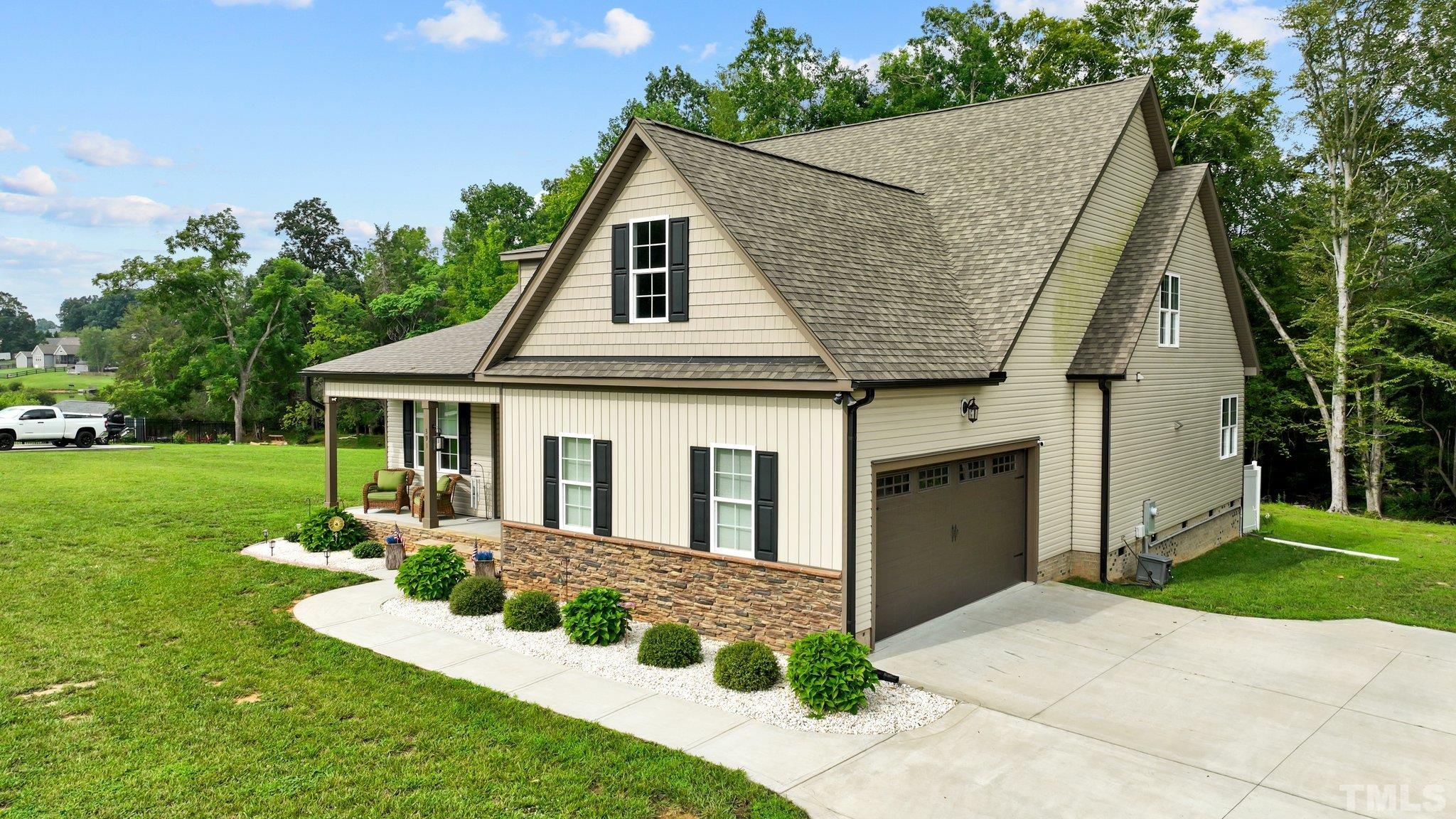 391 River Ridge Lane Timberlake, NC 27583 - Photo 41 of 47 a front view of a house with garden