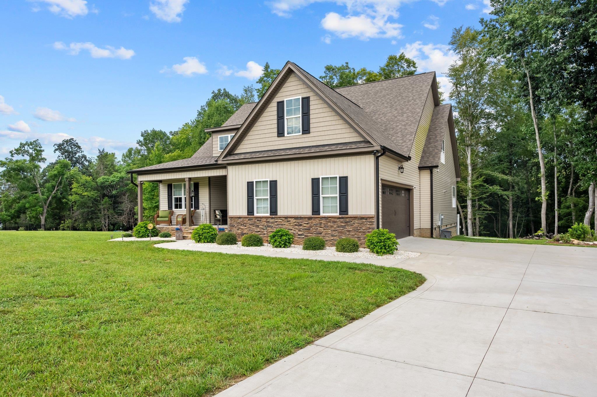391 River Ridge Lane Timberlake, NC 27583 - Photo 44 of 47 a front view of a house with a yard